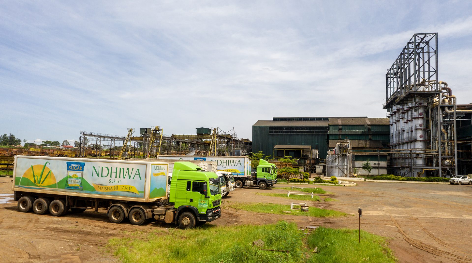 Ndhiwa Sukari branded delivery trucks at the factory